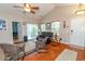 Inviting living room with hardwood floors, high ceiling, area rug, and leather sofa at 111 Rose Water Loop # 111, Myrtle Beach, SC 29588