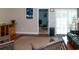 Comfortable living room with hardwood floors, area rug, and access to Florida room at 111 Rose Water Loop # 111, Myrtle Beach, SC 29588