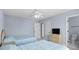 Neutral bedroom featuring two twin beds, ceiling fan, and an ensuite bathroom at 113A 9Th Ave. S, Surfside Beach, SC 29575