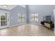 Bright, airy living room featuring a door to a porch and many windows at 113A 9Th Ave. S, Surfside Beach, SC 29575