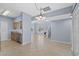 Spacious open floor plan with tile flooring, kitchen, and stairs at 113A 9Th Ave. S, Surfside Beach, SC 29575