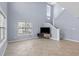 Inviting living room with neutral tile, staircase, and natural light from large windows at 113A 9Th Ave. S, Surfside Beach, SC 29575