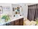 Well-lit bathroom featuring a floating vanity, decorative art, a neutral color palette, and stylish fixtures at 1147 Fairway Ln. # 1147, Conway, SC 29526