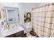 Cozy bathroom featuring a neutral color palette, framed art, and a decorative shower curtain at 1147 Fairway Ln. # 1147, Conway, SC 29526