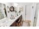 Bright bathroom with a double vanity, decorative mirrors, and lots of counter space for toiletries at 1147 Fairway Ln. # 1147, Conway, SC 29526