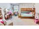 Bright bedroom with a bunkbed, vanity, chair, and decorative shelves at 1147 Fairway Ln. # 1147, Conway, SC 29526