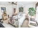 Comfortable bedroom featuring a four-poster bed, a seating area, and bright natural light at 1147 Fairway Ln. # 1147, Conway, SC 29526
