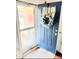 Inviting front door with a wreath and a glass screen door for natural light and ventilation at 1147 Fairway Ln. # 1147, Conway, SC 29526