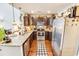 Well-lit kitchen featuring stainless steel appliances and granite countertops for modern cooking and dining at 1147 Fairway Ln. # 1147, Conway, SC 29526