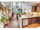 Modern kitchen featuring granite countertops and stainless-steel appliances flows seamlessly into the living area at 1147 Fairway Ln. # 1147, Conway, SC 29526