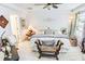Spacious main bedroom with a ceiling fan, neutral paint, and a large window to let in natural light at 1147 Fairway Ln. # 1147, Conway, SC 29526