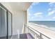 Ocean view from the private balcony with a table and chair at 1205 S Ocean Blvd. # 20609, Myrtle Beach, SC 29577
