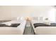 Bright bedroom features two beds with two towels and blankets on top at 1205 S Ocean Blvd. # 20609, Myrtle Beach, SC 29577