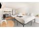 Bright bedroom features two beds, a kitchenette, and a round carpet at 1205 S Ocean Blvd. # 20609, Myrtle Beach, SC 29577