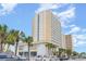 Modern resort building with well-manicured landscaping and ample parking at 1205 S Ocean Blvd. # 20609, Myrtle Beach, SC 29577