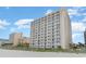 Exterior shot of resort building showcasing multiple floors with private balconies and great views at 1205 S Ocean Blvd. # 20609, Myrtle Beach, SC 29577