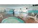 Beautiful indoor pool and hot tub area with lounge chairs for relaxation at 1205 S Ocean Blvd. # 20609, Myrtle Beach, SC 29577