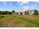 A spacious backyard with a covered patio offers outdoor seating for enjoying serene views and relaxation at 125 Mountain Ash Ln., Myrtle Beach, SC 29579
