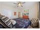 Relaxing bedroom with ceiling fan, warm lighting, and stylish furnishings at 125 Mountain Ash Ln., Myrtle Beach, SC 29579