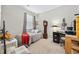 A carpeted bedroom featuring a daybed, a grandfather clock, and a desk with a computer at 125 Mountain Ash Ln., Myrtle Beach, SC 29579