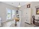 Charming dining area with seating for two and an access door to an outdoor patio at 125 Mountain Ash Ln., Myrtle Beach, SC 29579