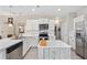 Modern kitchen featuring stainless steel appliances, white cabinets, and wood-look flooring at 125 Mountain Ash Ln., Myrtle Beach, SC 29579