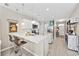 Bright kitchen boasts white cabinets, stainless appliances, pendant lighting and an eat-in island at 125 Mountain Ash Ln., Myrtle Beach, SC 29579