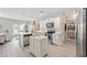 Charming kitchen with stainless steel appliances, white cabinetry, and rustic wood accents at 125 Mountain Ash Ln., Myrtle Beach, SC 29579