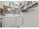 Functional laundry area equipped with a washer, dryer, and ample storage shelving at 125 Mountain Ash Ln., Myrtle Beach, SC 29579