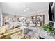 Open-concept living area featuring hardwood floors, a spacious seating area, and natural light at 125 Mountain Ash Ln., Myrtle Beach, SC 29579