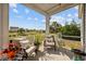 A cozy screened-in patio features comfortable seating and a serene outdoor view at 125 Mountain Ash Ln., Myrtle Beach, SC 29579