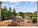 Backyard patio with seating area, grill, and a serene view of the surrounding landscape at 125 Mountain Ash Ln., Myrtle Beach, SC 29579