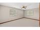Spacious bedroom with a ceiling fan and windows providing natural light at 1314 Holly Dr., North Myrtle Beach, SC 29582