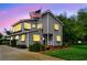 Two-story gray home featuring classic architecture, an American flag, and a well-maintained front lawn at 1314 Holly Dr., North Myrtle Beach, SC 29582