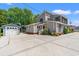 View of a cozy home featuring a detached garage, a well-maintained driveway, and mature trees at 1314 Holly Dr., North Myrtle Beach, SC 29582