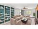 A bright living room features a neutral color palette, built-in bookshelves, and comfortable seating area at 1314 Holly Dr., North Myrtle Beach, SC 29582