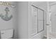 Bathroom with shower and toilet, decorated with nautical themed accents at 1416 Castleberry Pl., Myrtle Beach, SC 29588