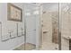 Tiled shower with glass door and built-in shelves in a neutral-toned bathroom at 1416 Castleberry Pl., Myrtle Beach, SC 29588