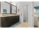 Well-lit bathroom featuring a dual sink vanity with dark wood cabinets and granite countertop at 1416 Castleberry Pl., Myrtle Beach, SC 29588