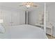 Well-lit primary bedroom with neutral colors, ceiling fan, and decorative coastal touches at 1416 Castleberry Pl., Myrtle Beach, SC 29588