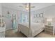 Bedroom featuring four-poster bed, ceiling fan, and nautical decor, creating a relaxing space at 1416 Castleberry Pl., Myrtle Beach, SC 29588