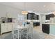 Charming eat-in kitchen featuring dark cabinets, a bright eating area, and stylish decor at 1416 Castleberry Pl., Myrtle Beach, SC 29588