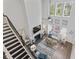 Aerial view of the living room with fireplace, staircase, and natural light from high windows at 1416 Castleberry Pl., Myrtle Beach, SC 29588