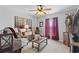 Relaxing living room with two comfy chairs, end tables, and a large picture window at 1416 Castleberry Pl., Myrtle Beach, SC 29588