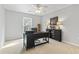 Office space with dark furnishings, carpeted floors, ceiling fan and lots of natural light at 1416 Castleberry Pl., Myrtle Beach, SC 29588