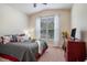 Cozy bedroom with a comfortable bed, soft carpet, and a bright window view at 1434 Chanson Ct., Little River, SC 29566