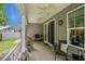 Charming covered patio with ceiling fans, grill, and comfortable seating for relaxing outdoors at 1434 Chanson Ct., Little River, SC 29566