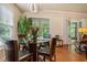 Cozy dining area with a round glass table, leather chairs, and natural light at 1434 Chanson Ct., Little River, SC 29566