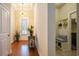 Warm foyer features hardwood floors, tray ceiling, and stylish decor at 1434 Chanson Ct., Little River, SC 29566
