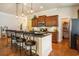 Kitchen island with seating, granite countertops, pendant lighting, and stainless steel appliances at 1434 Chanson Ct., Little River, SC 29566